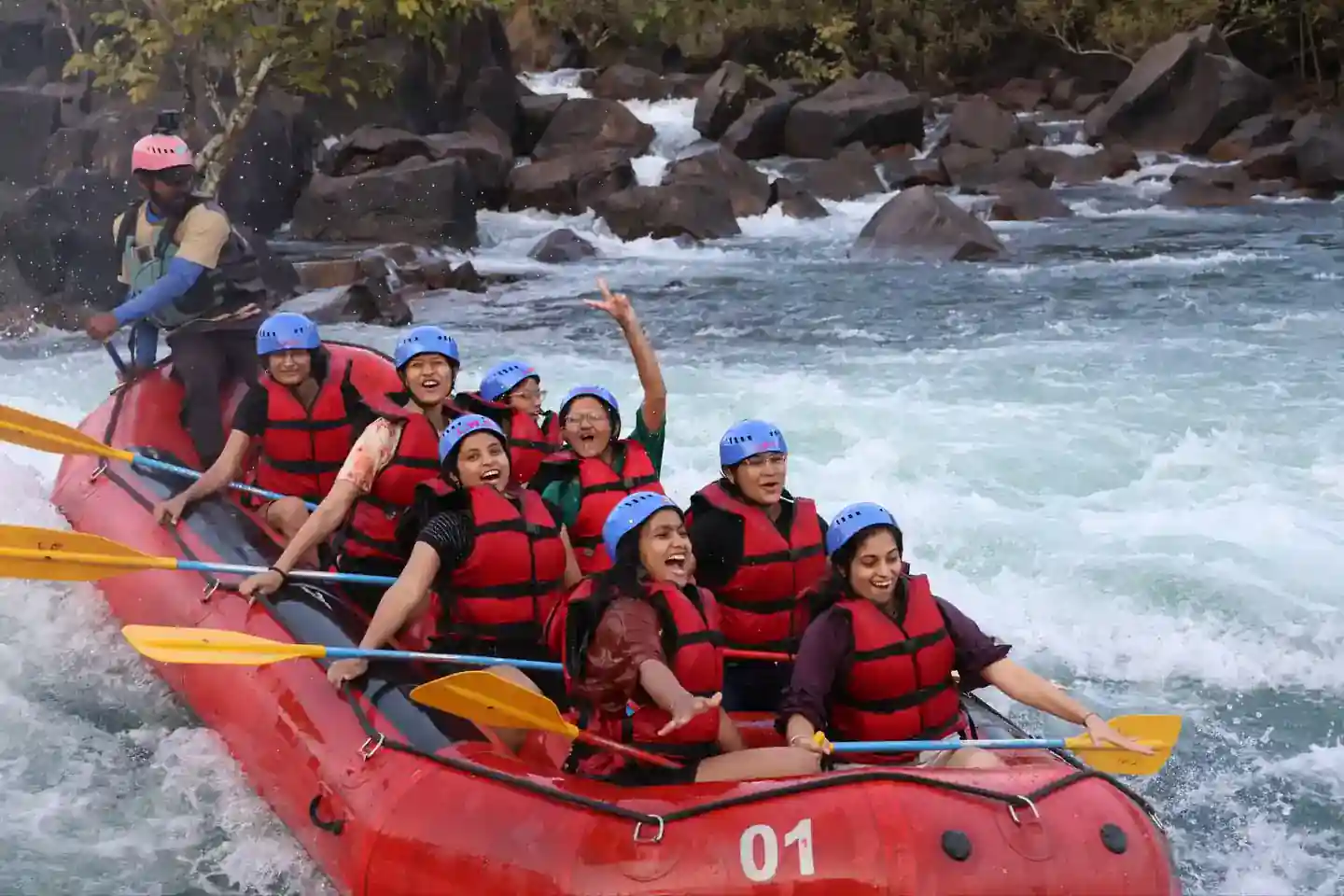 Women's rafting group navigating rapids on Kali River in Dandeli