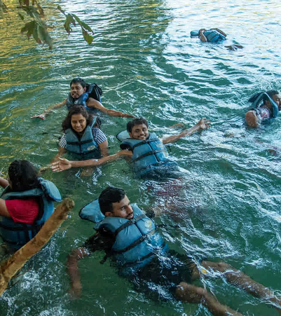 Swimming in Dandeli - River Water Activity Swimming activity in safe designated areas of Kali River near Dandeli resorts