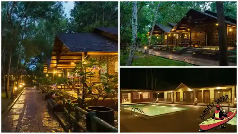 Illuminated Dandeli resort at night surrounded by lush Western Ghats forest