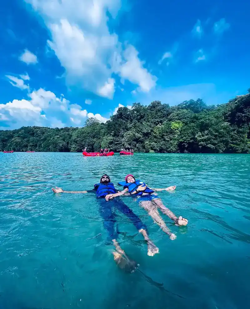 Couple enjoying private swimming pool at romantic Dandeli resort