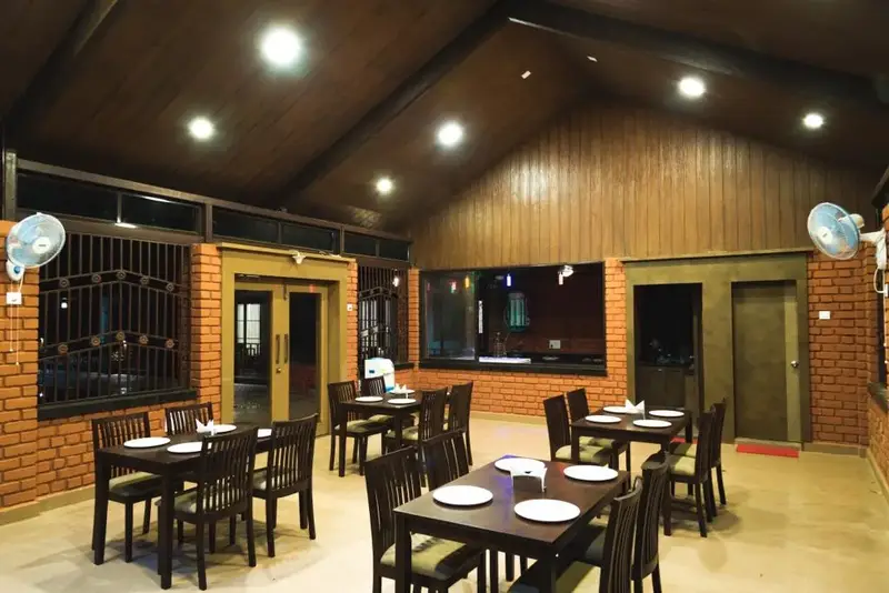 Spacious family dining area at Dandeli resort serving local and continental cuisine
