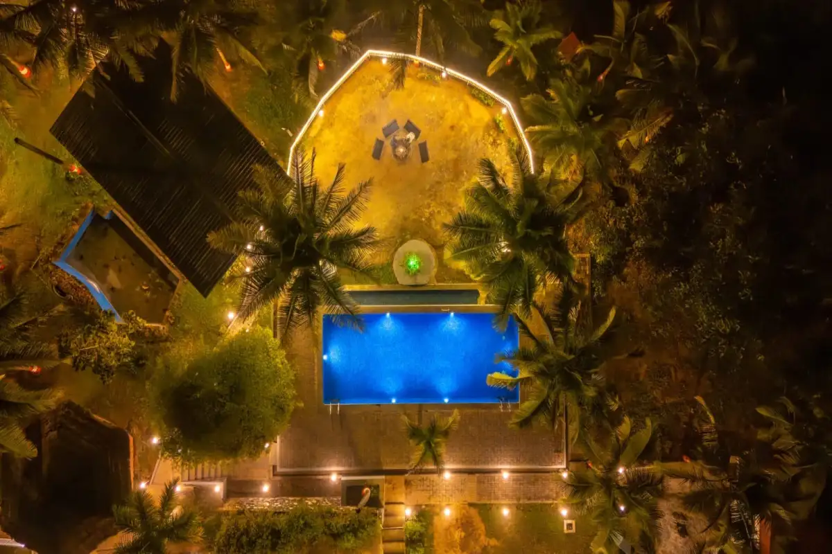 Complete aerial night view of Wild Mist Jungle Stay resort complex in Dandeli